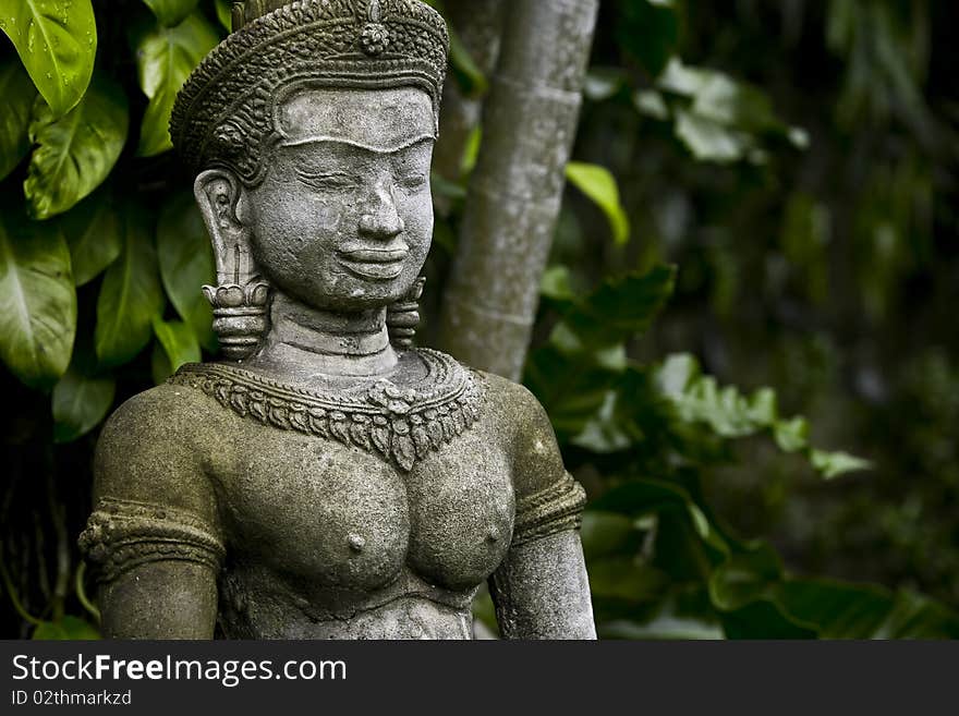 View of nice Buddha statue in tropic environment. View of nice Buddha statue in tropic environment