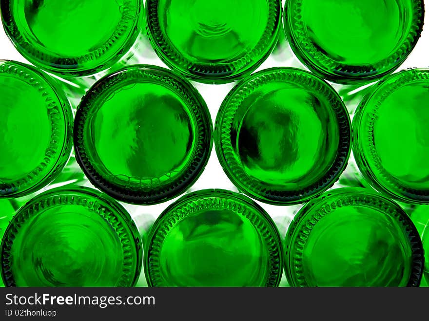 Bottoms of empty glass bottles on white background