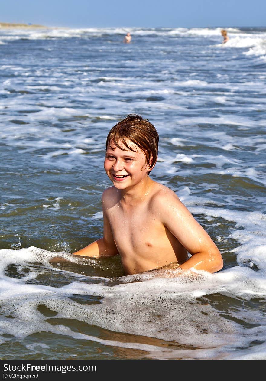 Boys enjoying the beautiful ocean and beach