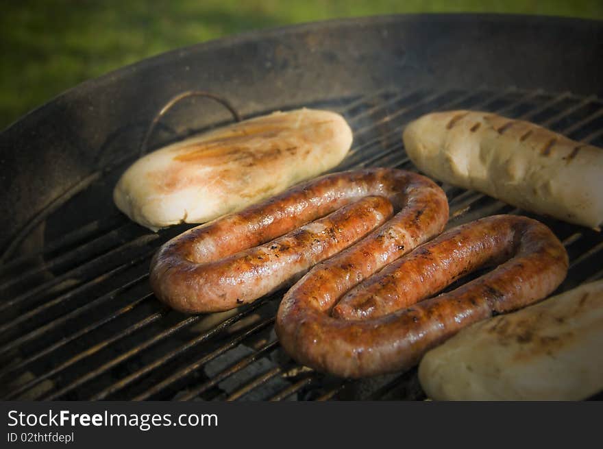 Sausage and bread rolls on the BBQ