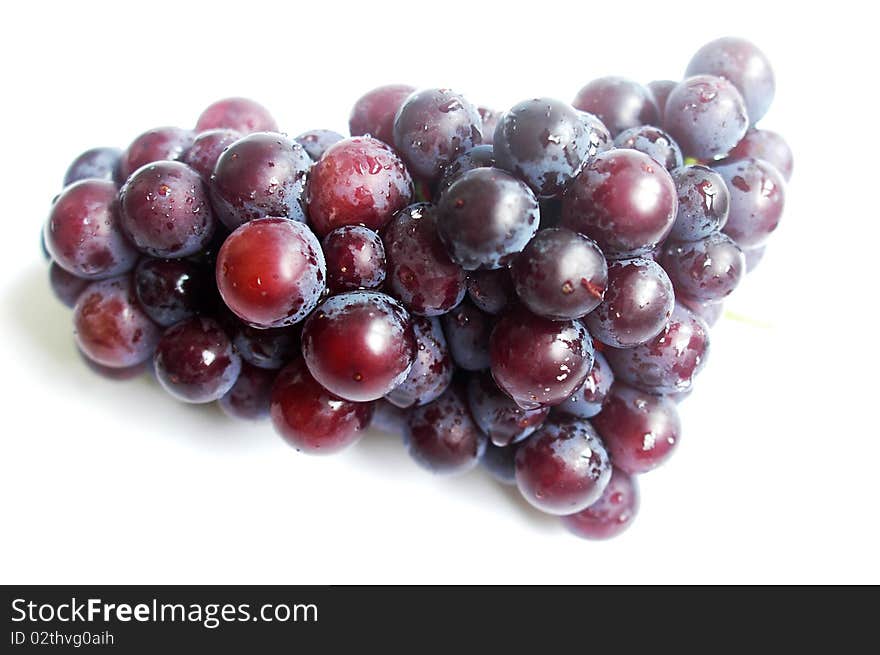 A cluster of grapes isolated on a white background.