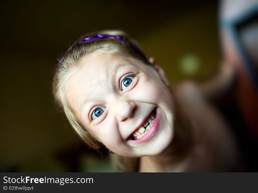 An image of a little girl making funny face. An image of a little girl making funny face