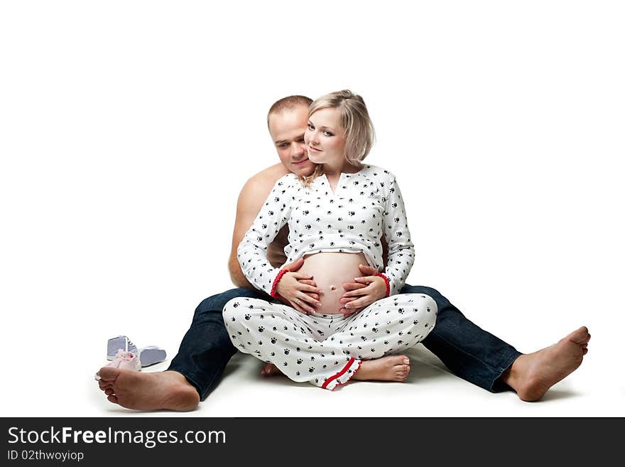 An image of a pregnant woman and her husband. An image of a pregnant woman and her husband