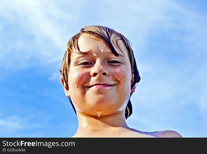 Boy enjoys the clear water in the ocean