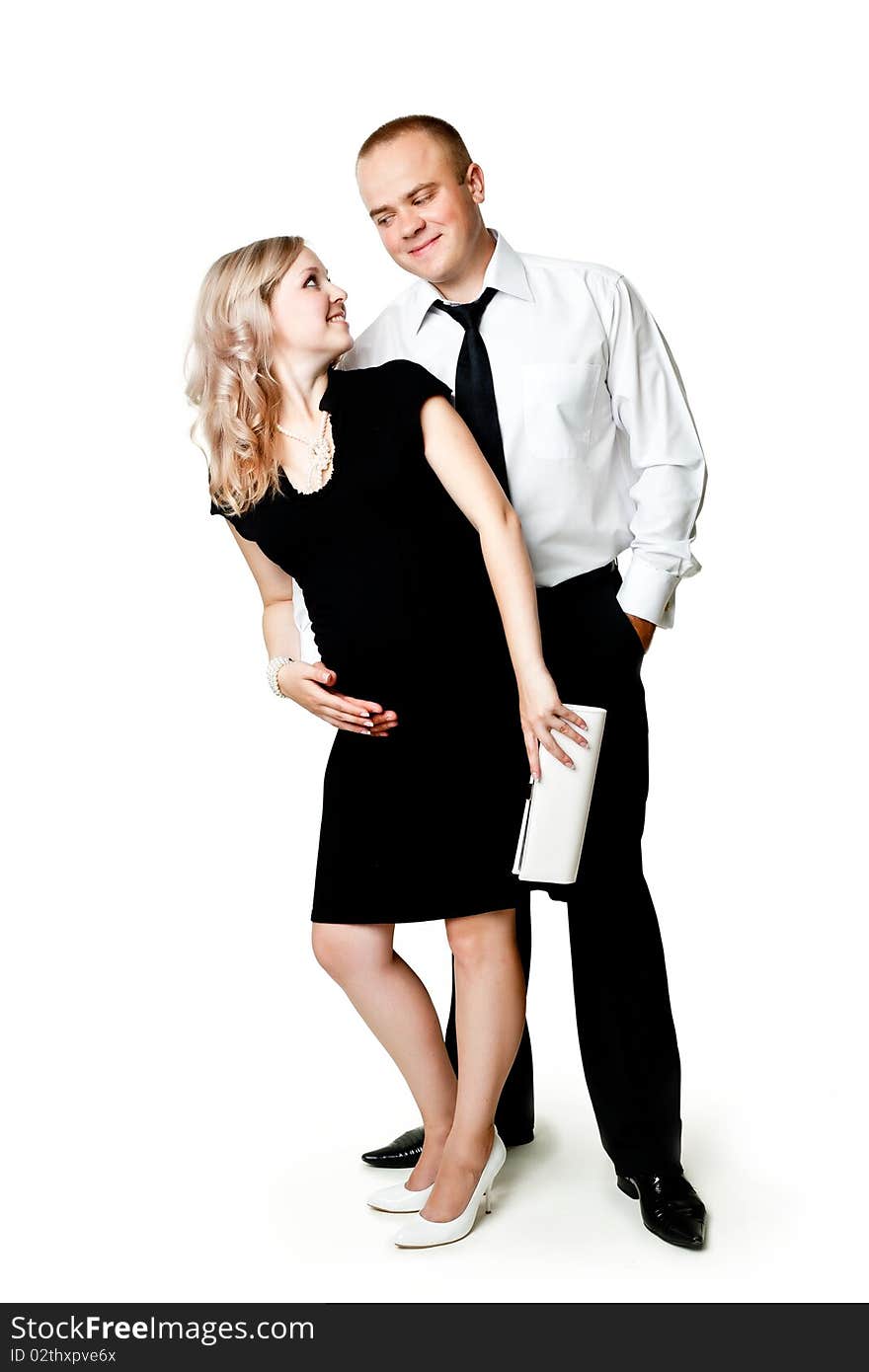 An image of a young pregnant woman and her husband. An image of a young pregnant woman and her husband