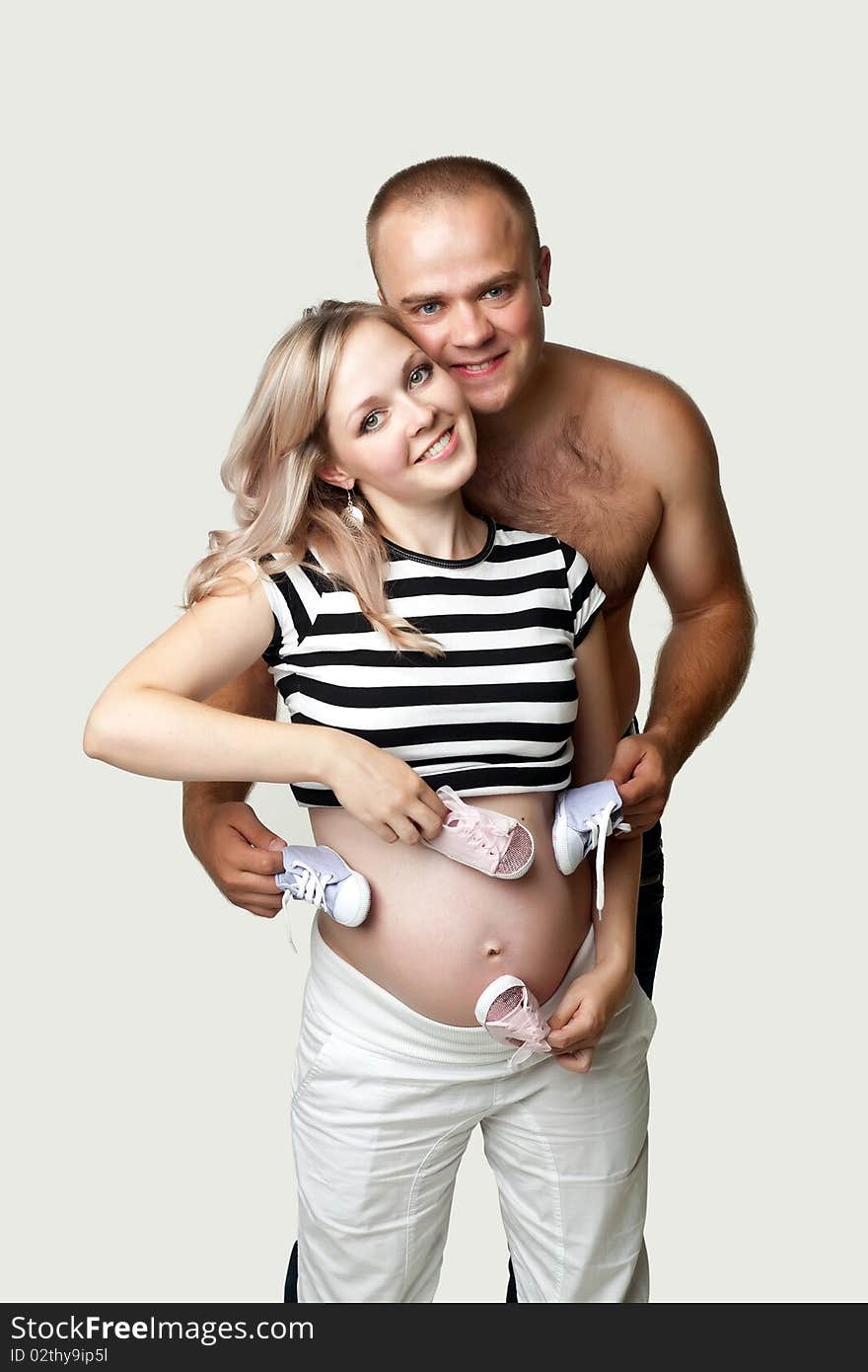 An image of a man and his pregnant wife. An image of a man and his pregnant wife