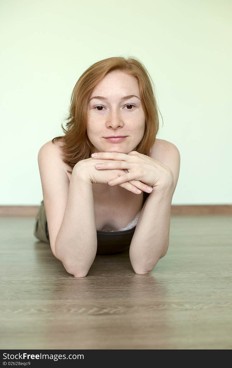 Redhead woman lying on the floor. Redhead woman lying on the floor