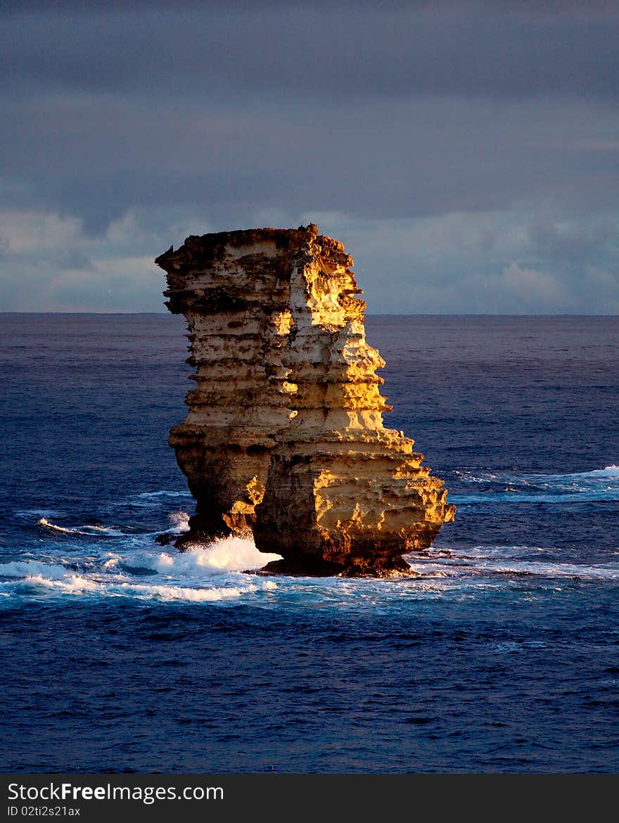 Rock stacks lit by setting sun. Rock stacks lit by setting sun