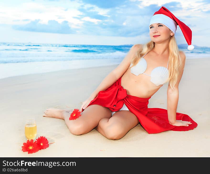 Miss Santa celebrates Christmas at the tropical beach. Miss Santa celebrates Christmas at the tropical beach