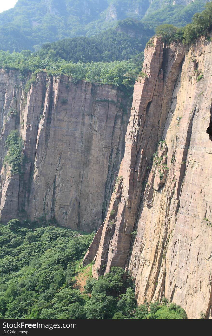 The Taihang Mountains are a Chinese mountain range running down the eastern edge of the Loess Plateau in Henan, Shanxi and Hebei provinces. The range extends over 400 km from north to south and has an average elevation of 1,500 to 2,000 meters. The principal peak is Xiao Wutaishan (2,882 metres). Cangyan Shan in Hebei forms the eastern tip of the Taihang range. The Taihang Mountains are a Chinese mountain range running down the eastern edge of the Loess Plateau in Henan, Shanxi and Hebei provinces. The range extends over 400 km from north to south and has an average elevation of 1,500 to 2,000 meters. The principal peak is Xiao Wutaishan (2,882 metres). Cangyan Shan in Hebei forms the eastern tip of the Taihang range.