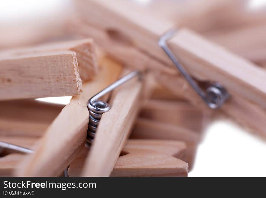 Pegs on white background. Close. Macro. Pegs on white background. Close. Macro.