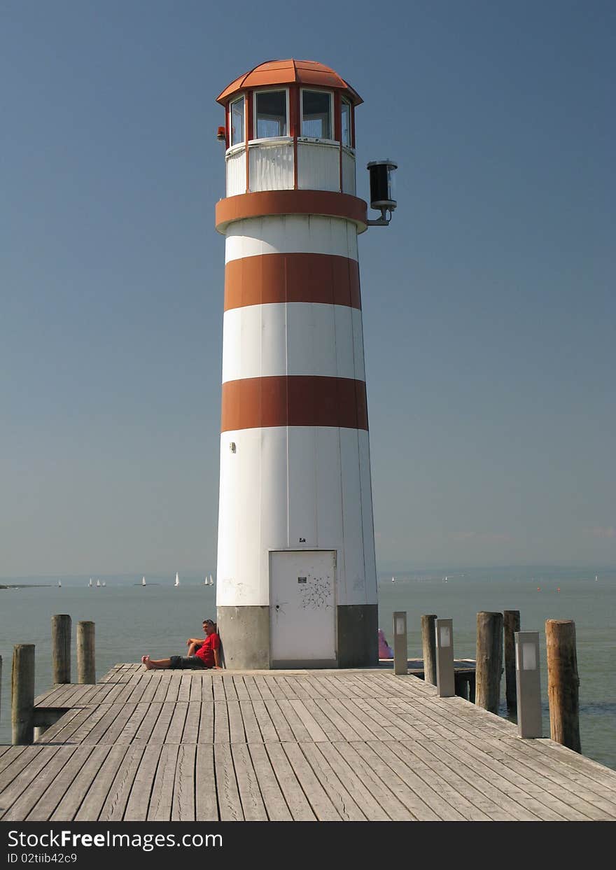 Lighthouse by sunny day on sea