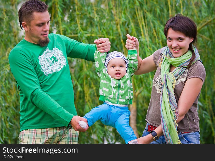 Happy family on a green background