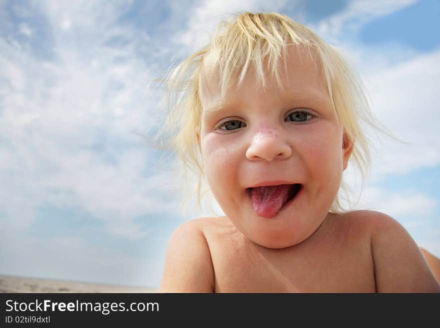 Funny child showing his tongue