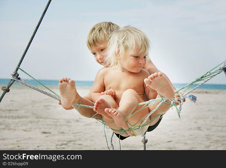 Two kids playing on beach