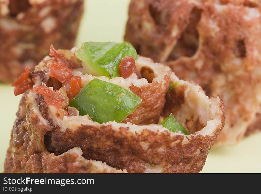 Close-up of a rolled pancake with salsa inside.