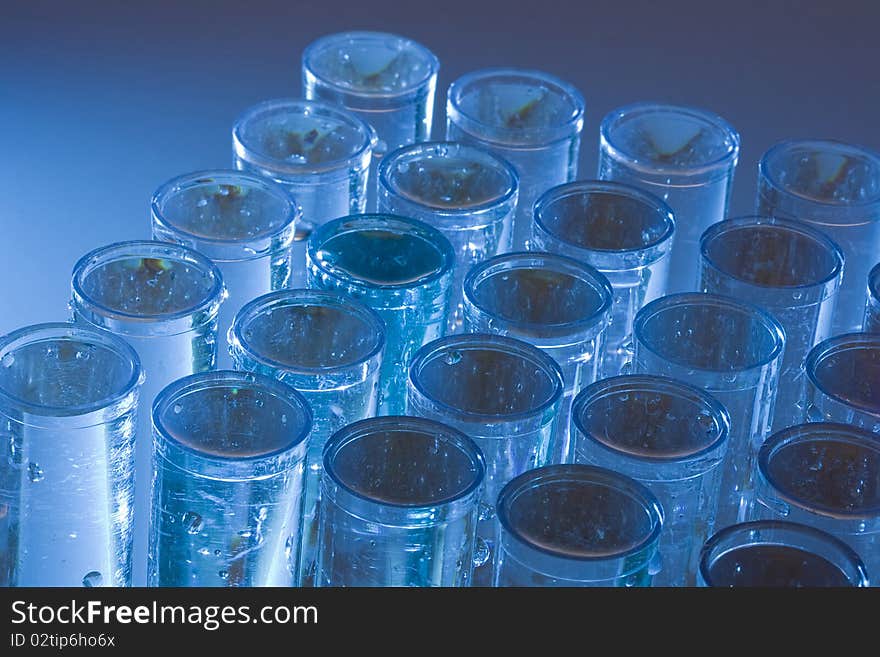 Set of test tubes on a blue background.