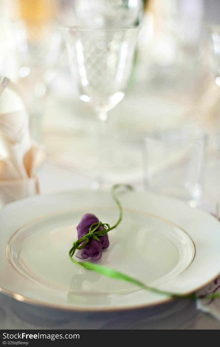 Dinner table catering serving with glasses creamy shallow dof