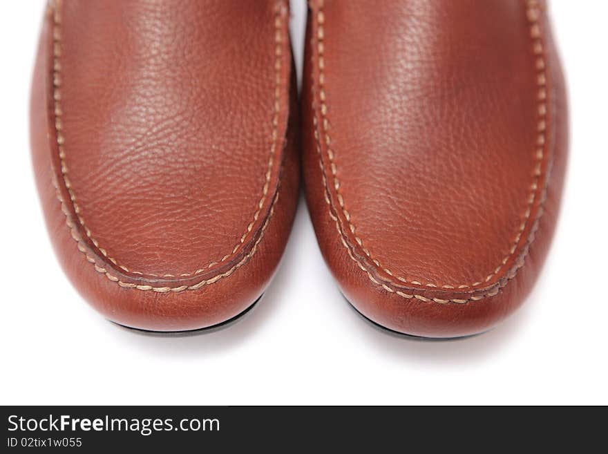 Brown leather shoes studio close-up shot on white background