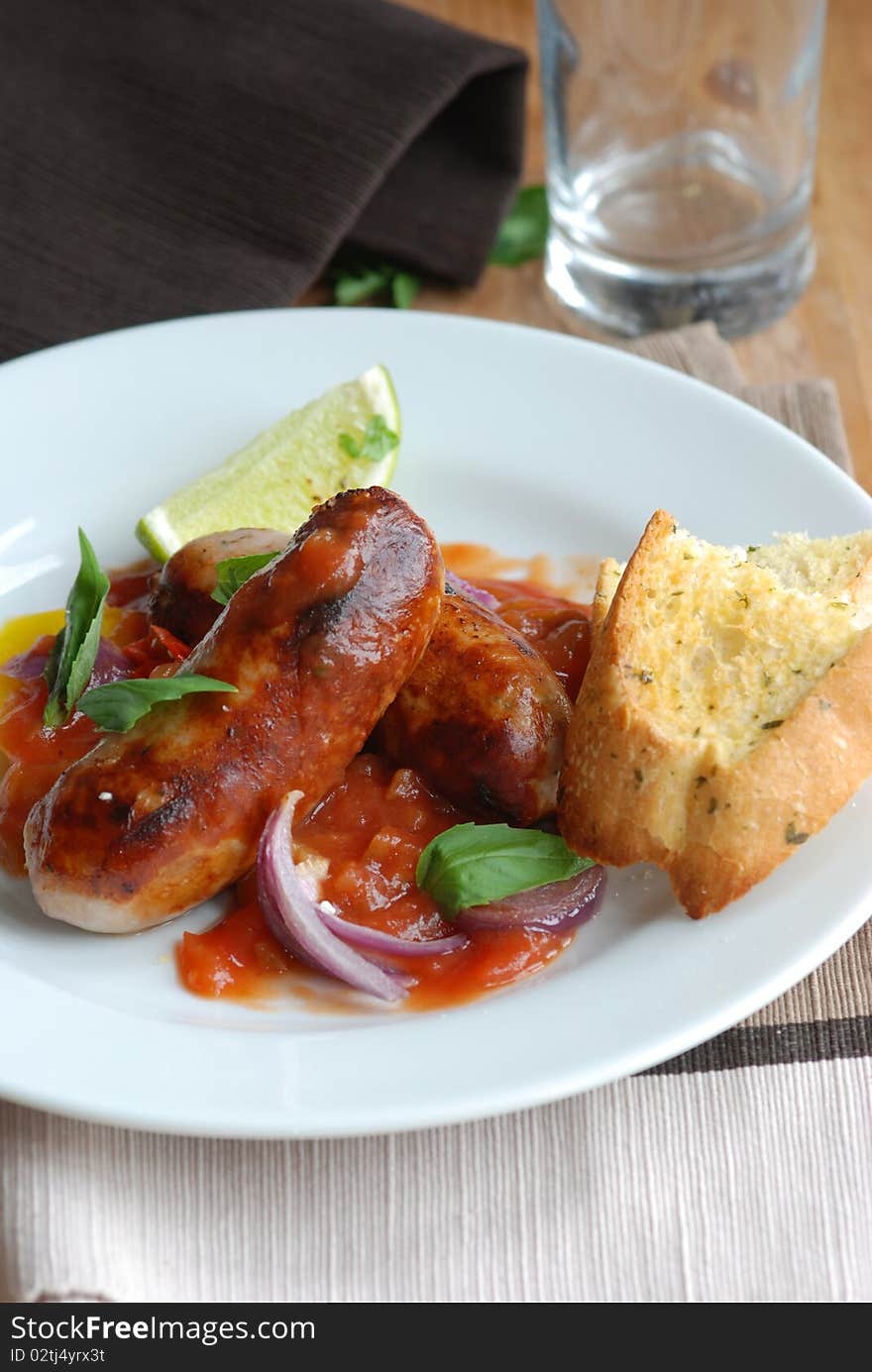 Sausage casserole with garlic bread