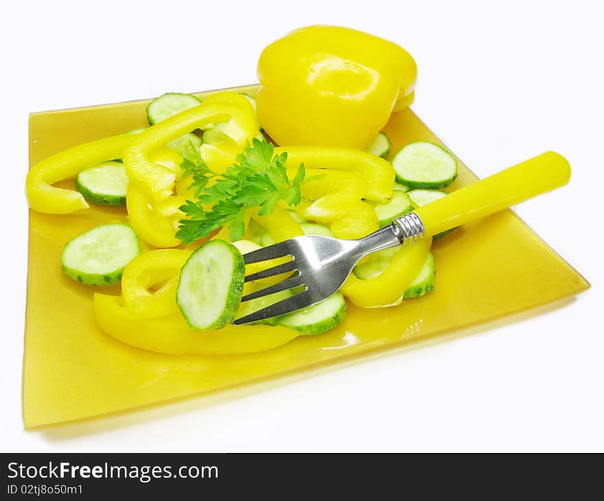 Vegetable salad with yellow pepper cucumber ready to eat with fork. Vegetable salad with yellow pepper cucumber ready to eat with fork