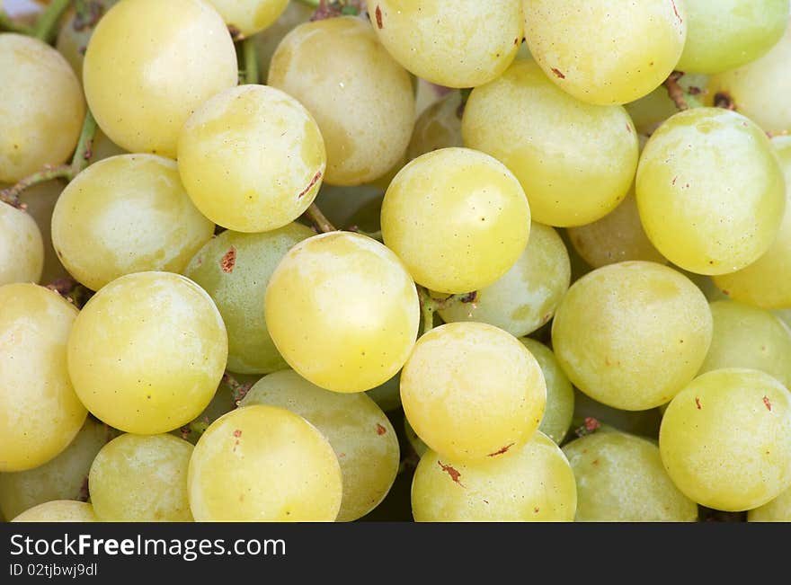 Ripe yellow grapes on the market