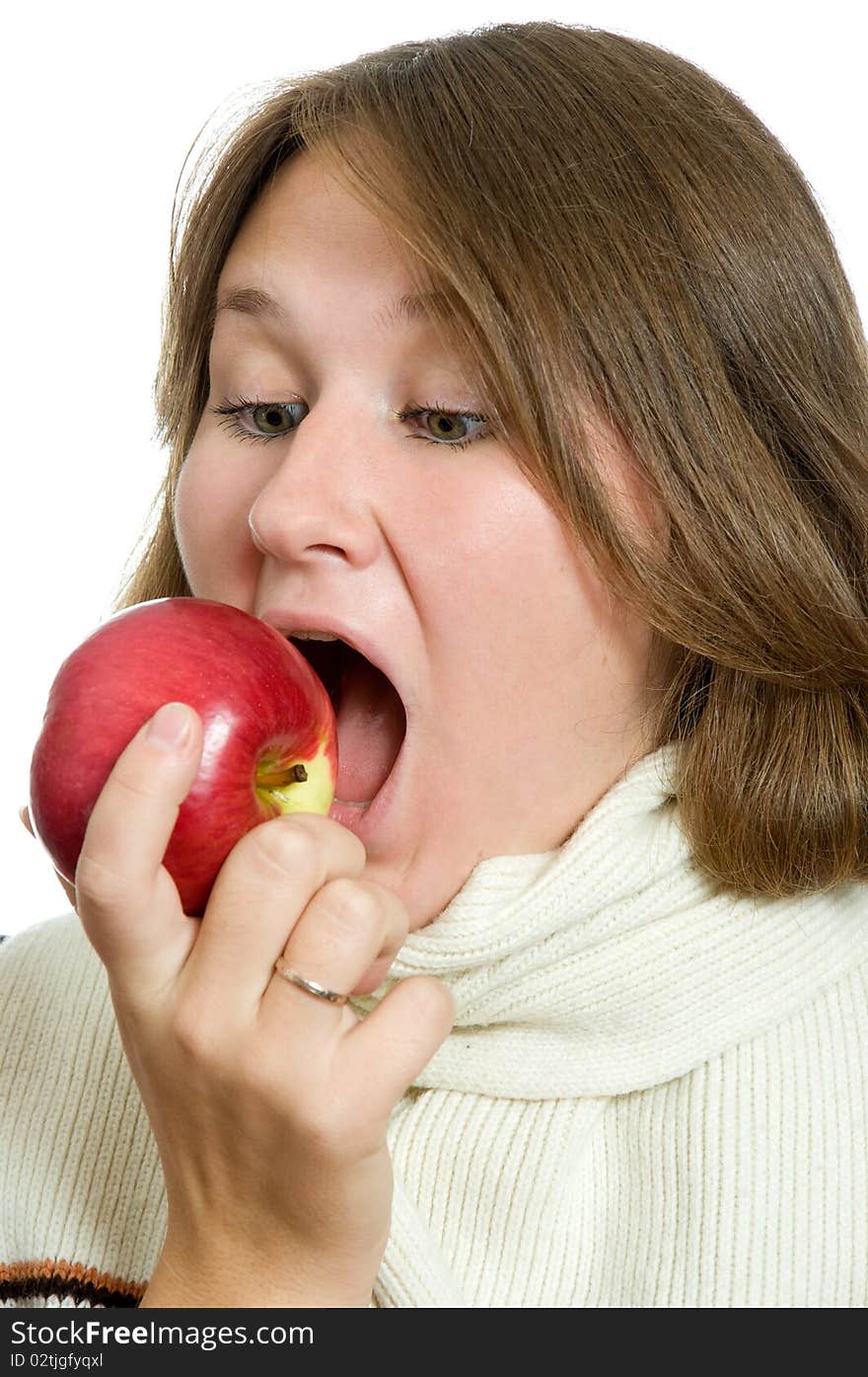 Portrait of woman eating apple over white