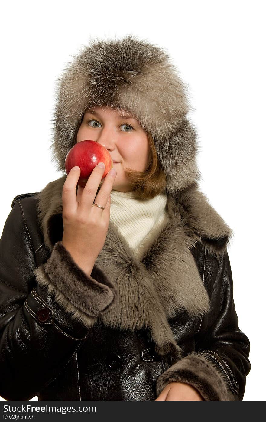 Young woman is smelling apple over white. Young woman is smelling apple over white