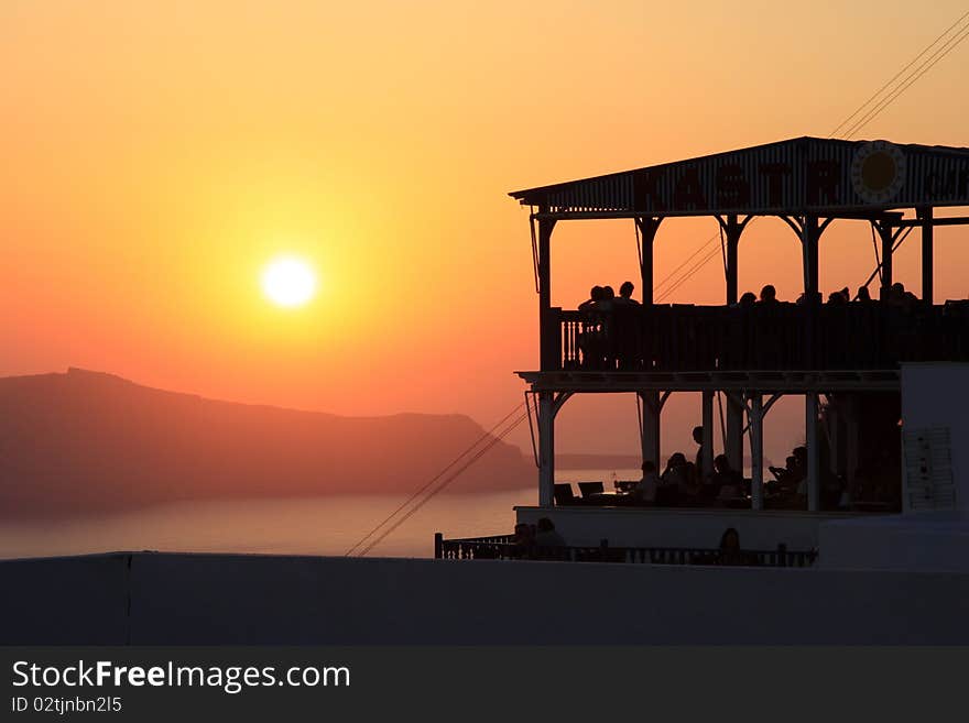 Sunset over the greece islands, view from greece islnad Santorini, belongs to Kyklades islands,Aegean sea. Very special orange sunset and beautiful nature.