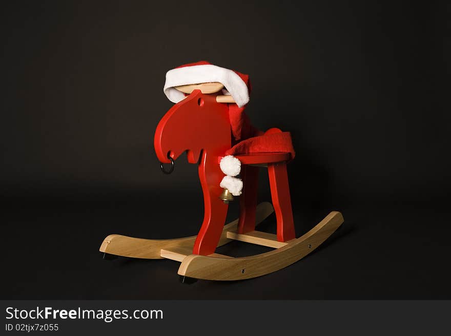 Rudolph the red nosed reindeer in santa hat. Rudolph the red nosed reindeer in santa hat