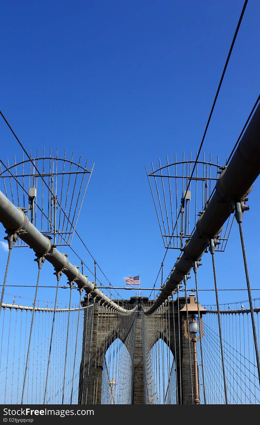 Brooklyn Bridge in New York City under a blue sky