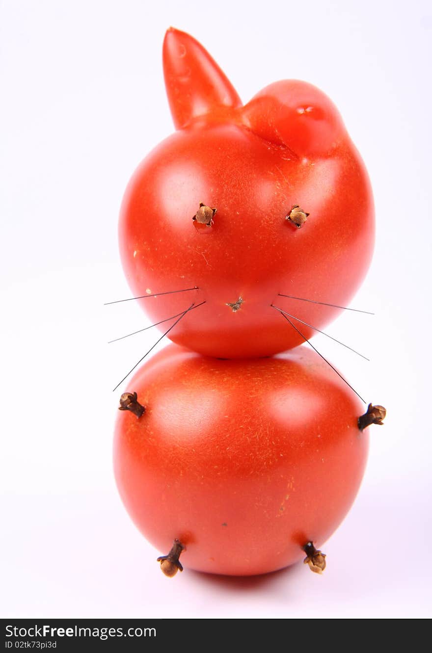 Rabbit made of tomatoes with eyes and legs made of dried cloves. Rabbit made of tomatoes with eyes and legs made of dried cloves