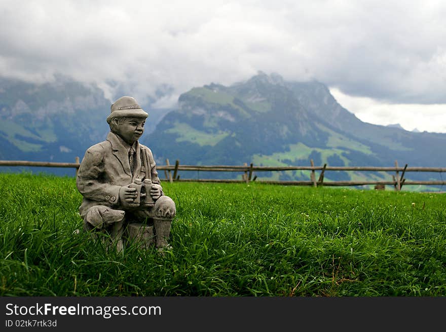 Sculpture gamekeeper over Appenzell in Swiss Alps. Sculpture gamekeeper over Appenzell in Swiss Alps