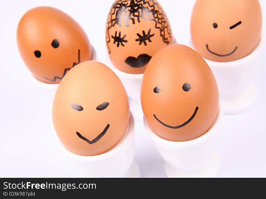 Eggs with smiling faces on white background. Eggs with smiling faces on white background