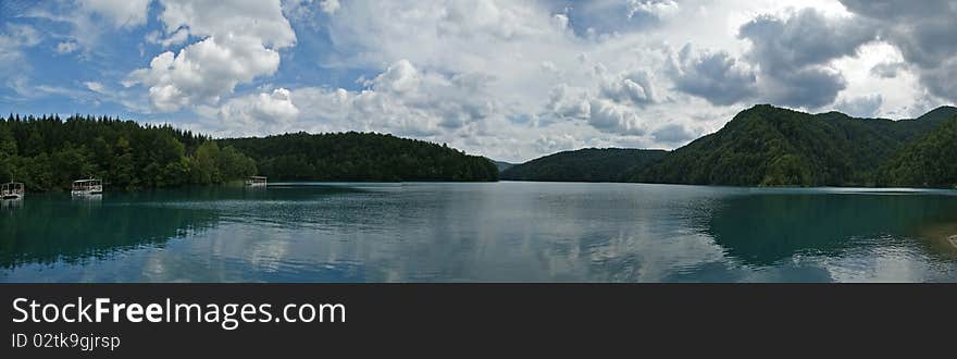 Panorama of a landscape consisting of mountains and lake