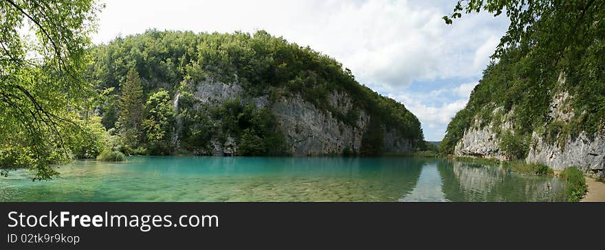 Panorama of a landscape consisting of mountains and lake