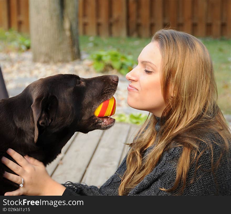 A beautiful girl enjoying a moment with her best friend. A beautiful girl enjoying a moment with her best friend.