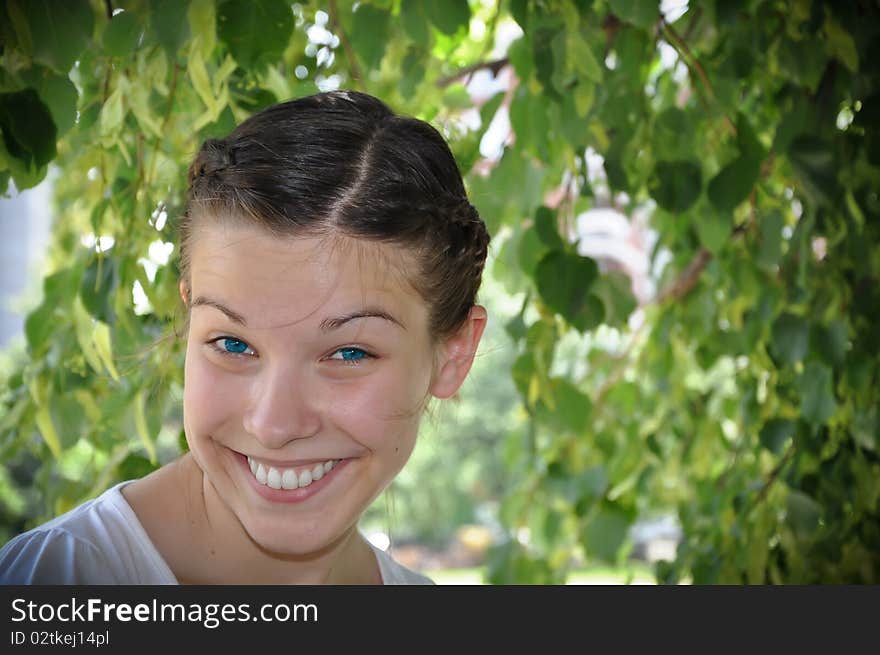 Young beautiful girl smile in the park. Young beautiful girl smile in the park