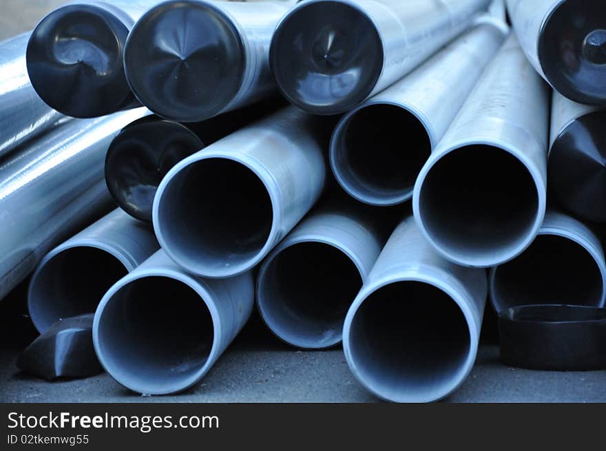 A stack of long cylinder pipes. A stack of long cylinder pipes.