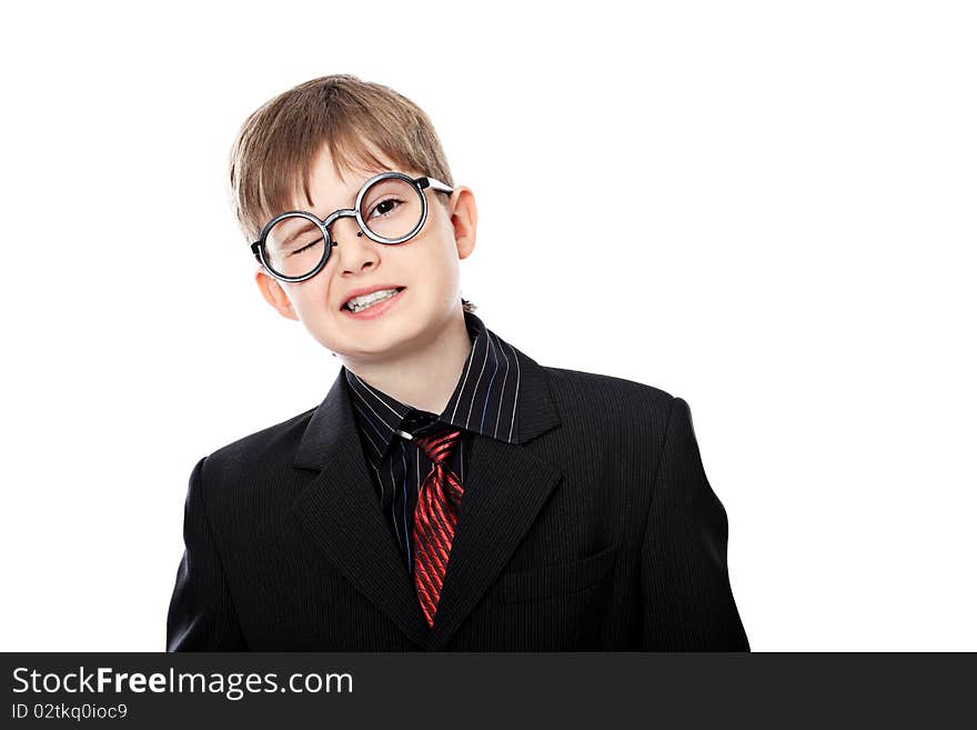 Educational theme: boy teenager posing in a suit and spectacles. Isolated over white background. Educational theme: boy teenager posing in a suit and spectacles. Isolated over white background.