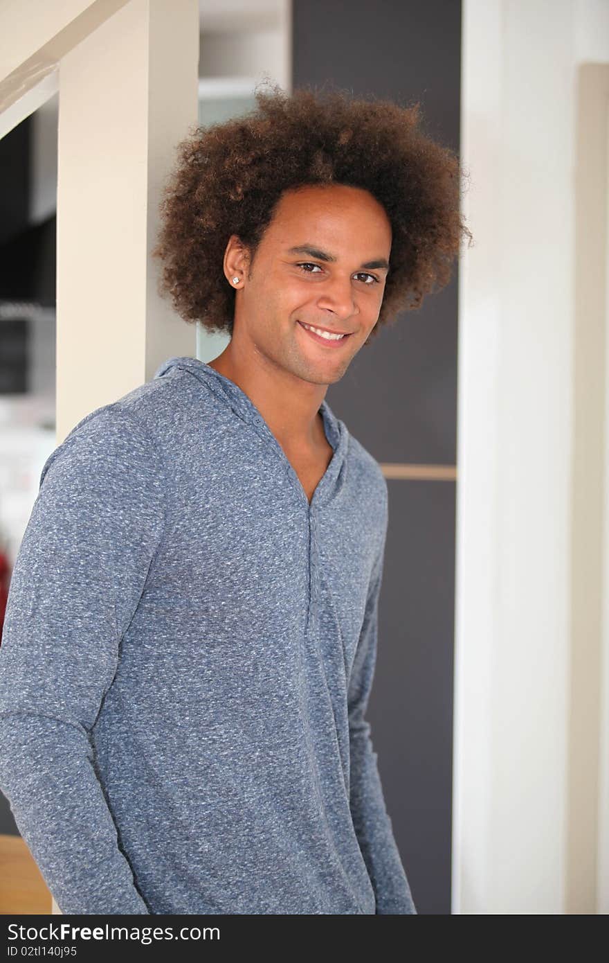 Young man standing in kitchen. Young man standing in kitchen