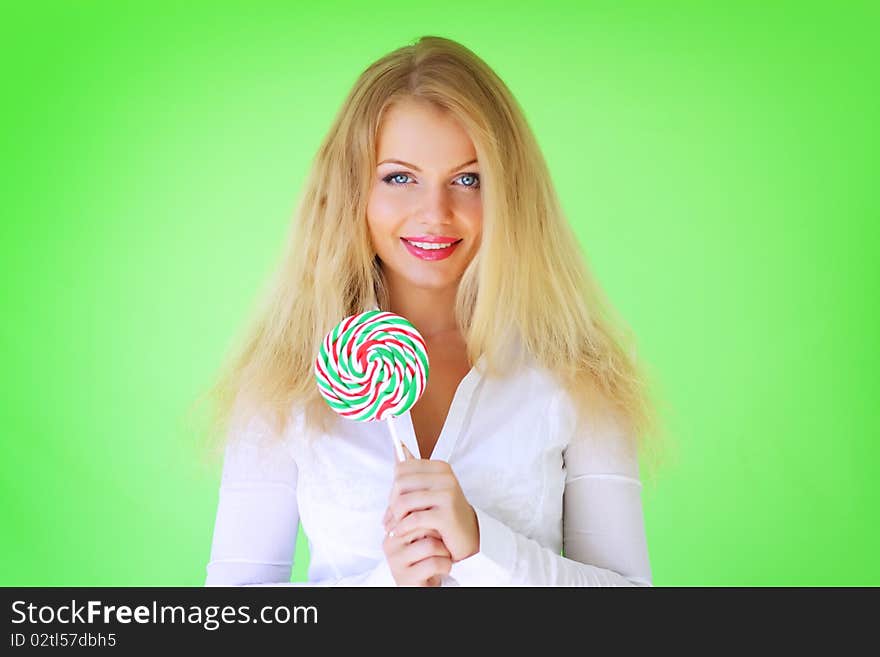 Beautiful girl holding lollipop