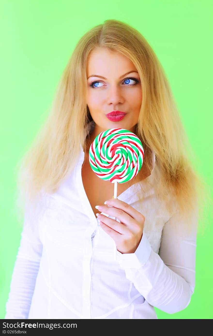 Beautiful girl holding lollipop