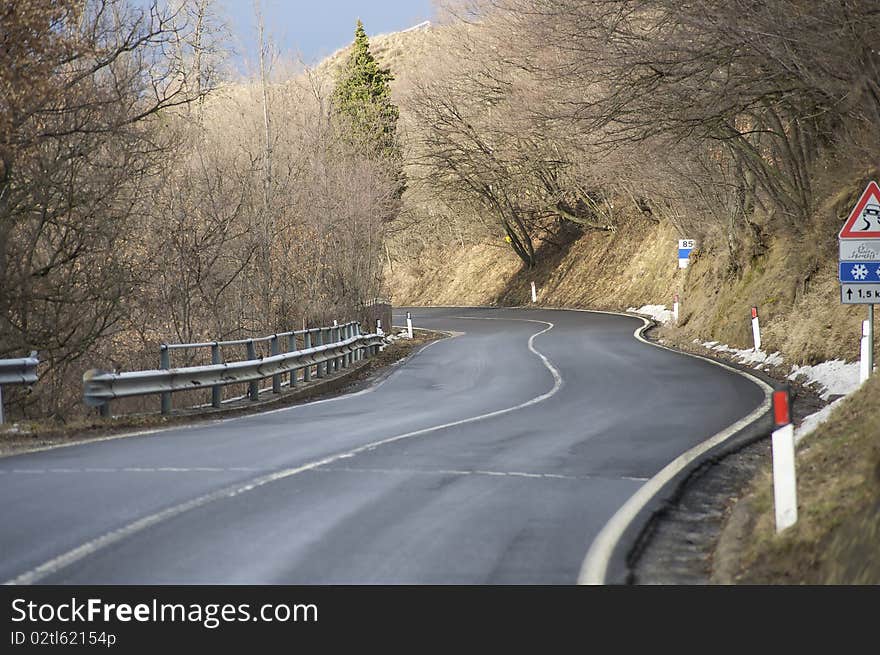 A mountain road turning on the left