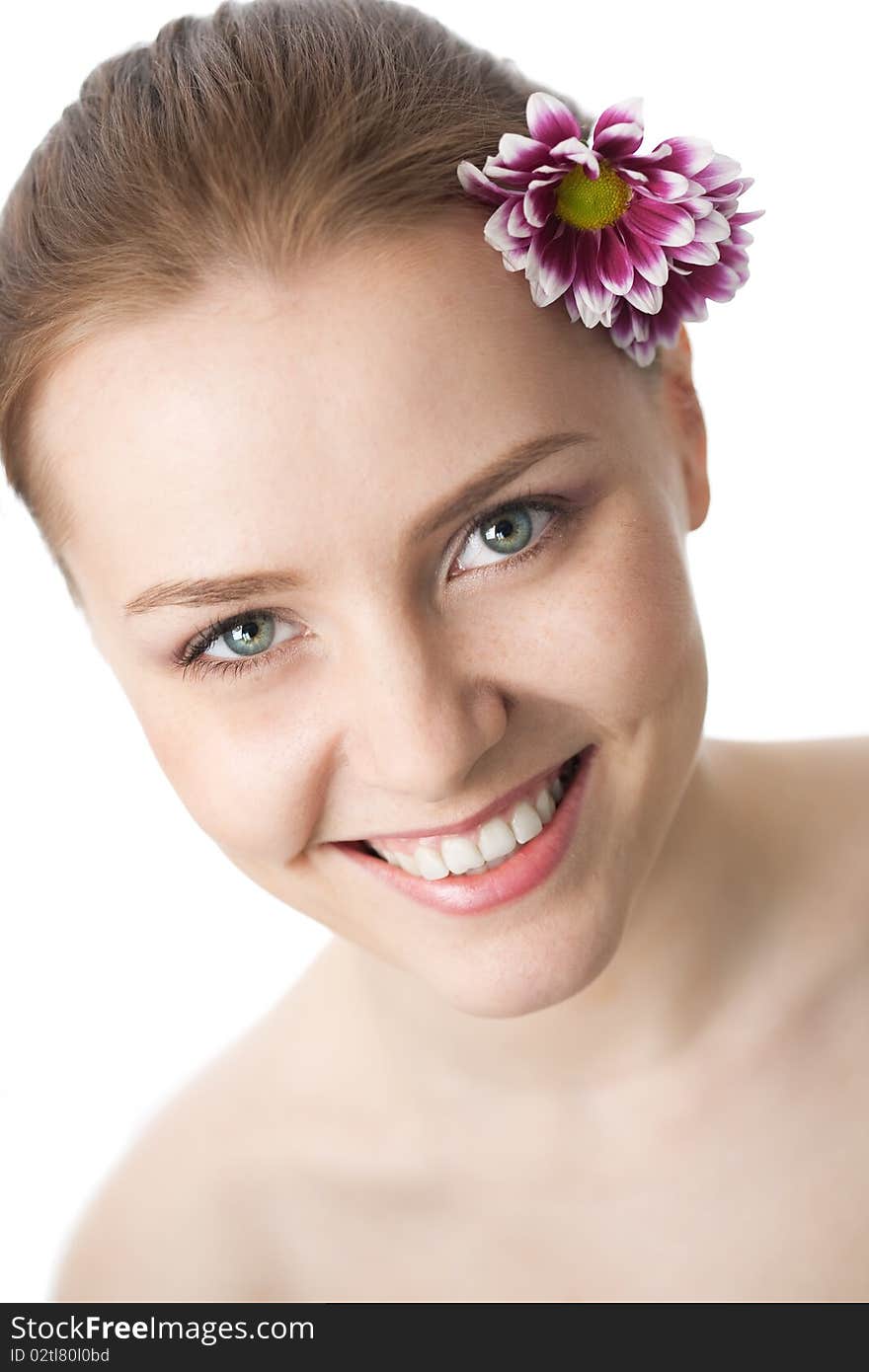 Beauty woman close-up face with flower over white background