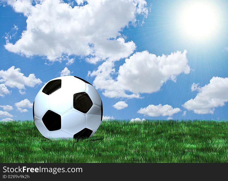 Soccer ball on green grass under blue sky