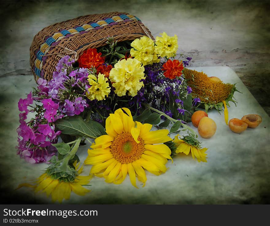 Basket with different, summer flowers. Basket with different, summer flowers