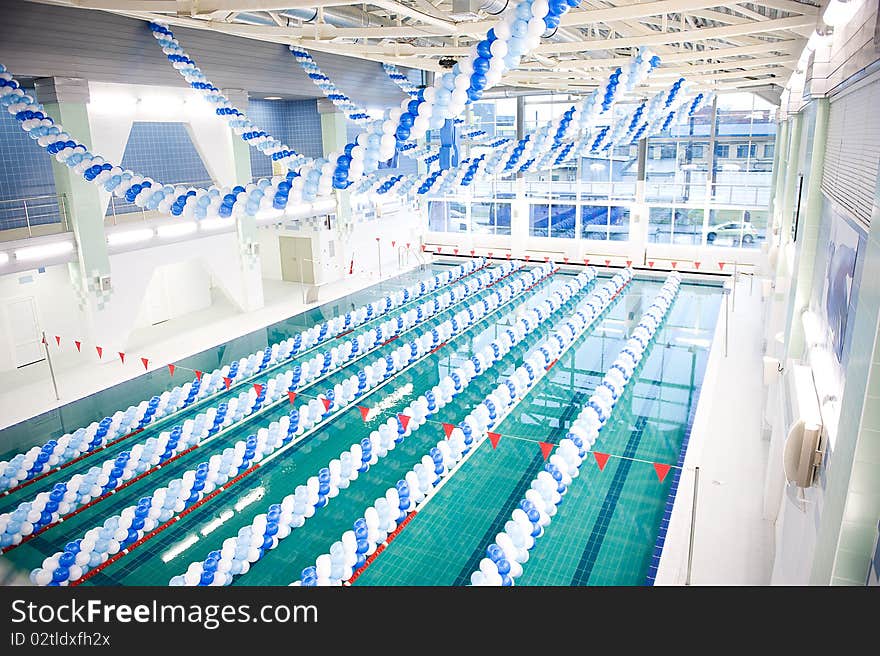 Swimmingpool decorated with blue and white balloons. Swimmingpool decorated with blue and white balloons