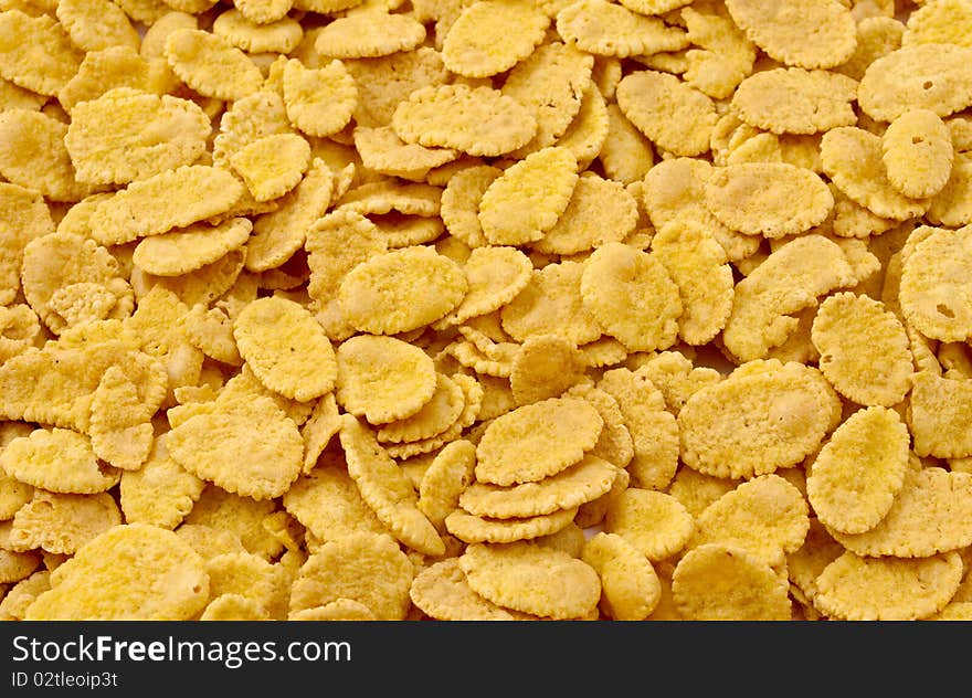 Background of yellow, brown cornflakes. Background of yellow, brown cornflakes