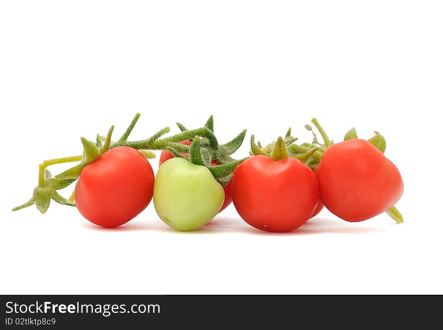 Green and red cherry tomatoes isolated on white